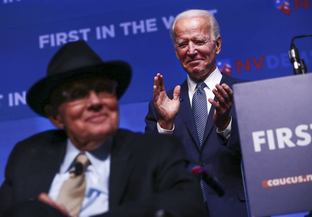 Democratic presidential candidate and former Vice President Joe Biden, right, claps as former U ...