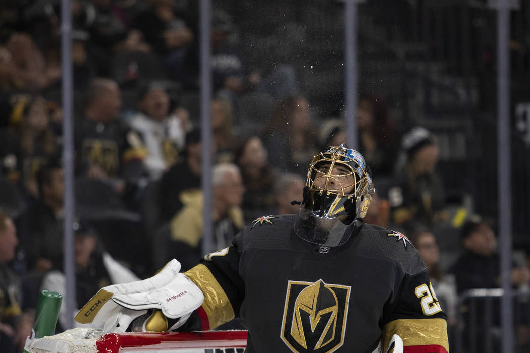 Golden Knights goaltender Marc-Andre Fleury (29) spits water during the third period of the gam ...
