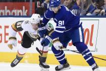 Vegas Golden Knights right wing Mark Stone (61) and Toronto Maple Leafs center John Tavares (91 ...