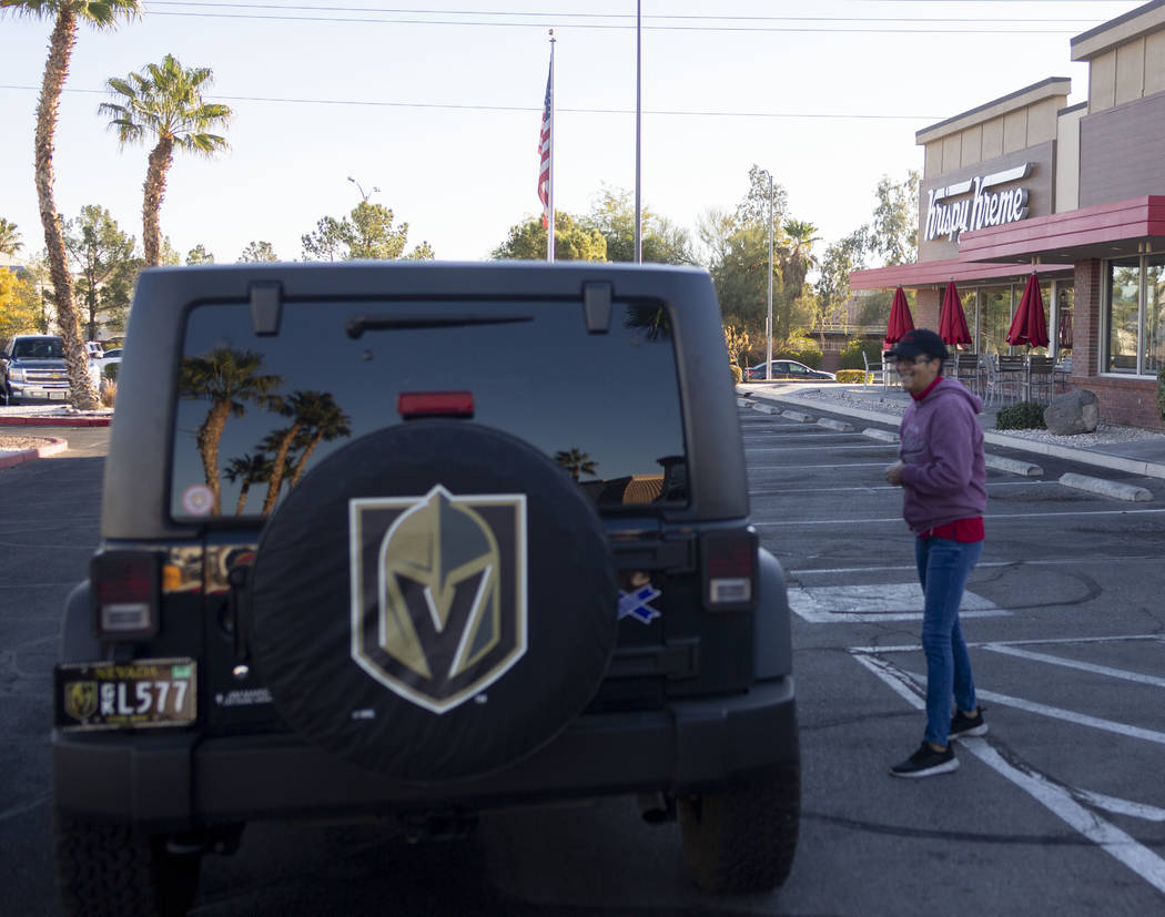 Krispy Kreme processors Sandra Nunez tells a Golden Knight fan that the store is closed at the ...