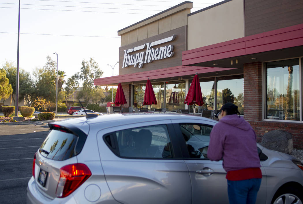 Golden Knight fans drive up to the Krispy Kreme store at 9791 S. Eastern Ave. in Henderson on M ...