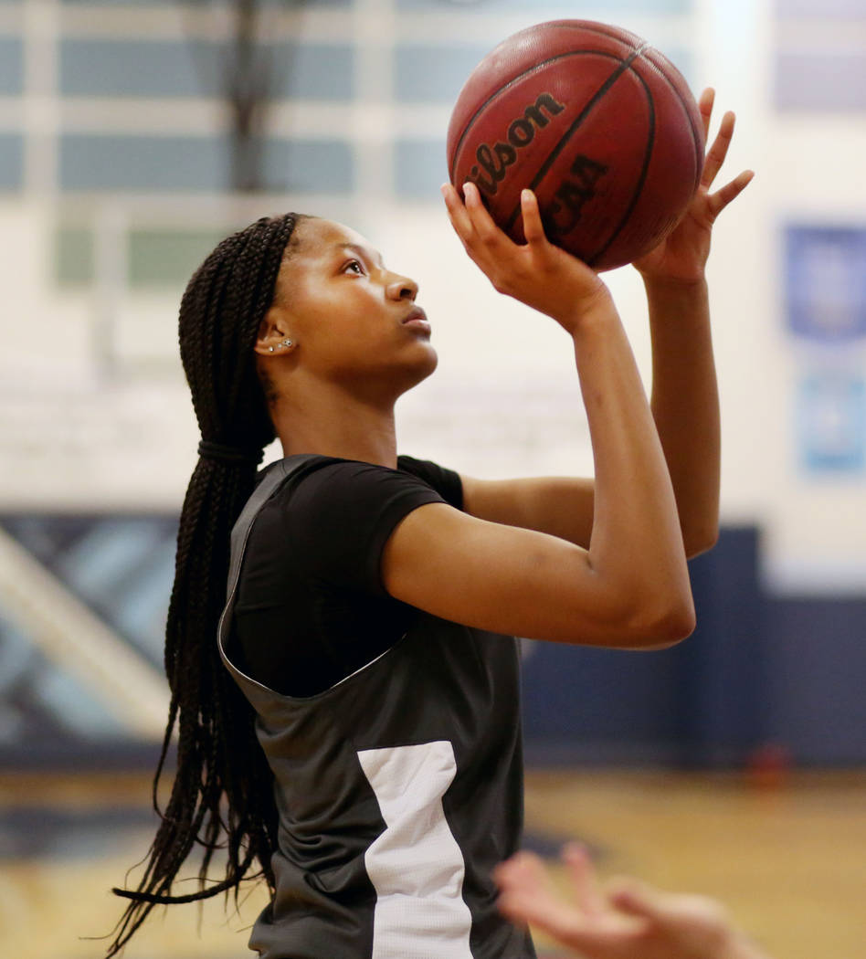 Centennial junior Taylor Bigby, shoots a basket during varsity practice at Centennial high scho ...