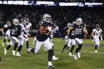 Oakland Raiders' Dwayne Harris (17) returns a punt for a touchdown against the Denver Broncos d ...