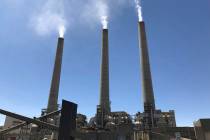 This Aug. 20, 2019, image shows a trio of concrete stacks at the Navajo Generating Station near ...