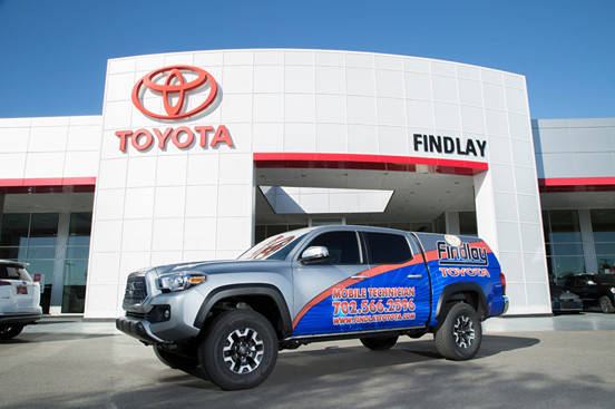 Findlay Toyota’s mobile repair service department vehicle is parked in front of the dealershi ...