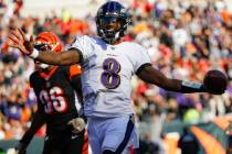 Baltimore Ravens quarterback Lamar Jackson (8) celebrates his touchdown during the second half ...