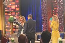 Shania Twain responds to a standing ovation as she is greeted by Ryan Seacrest and Kelly Ripa o ...