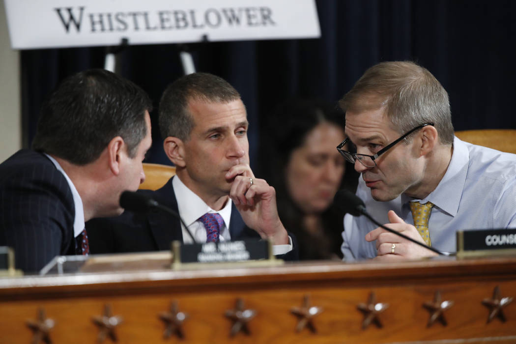 Ranking member Rep. Devin Nunes of Calif.,left, Steve Castor, the Republican staff attorney, ce ...