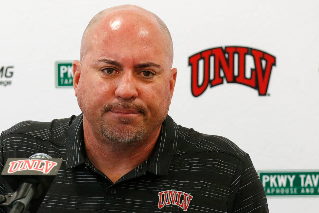 UNLV football head coach Tony Sanchez listens to a reporter's question during a news conference ...