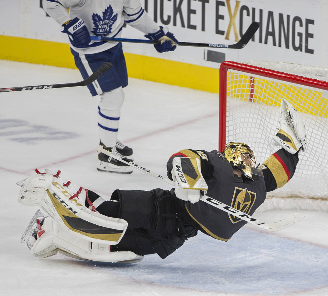 Vegas Golden Knights goaltender Marc-Andre Fleury (29) makes a diving save in the third period ...
