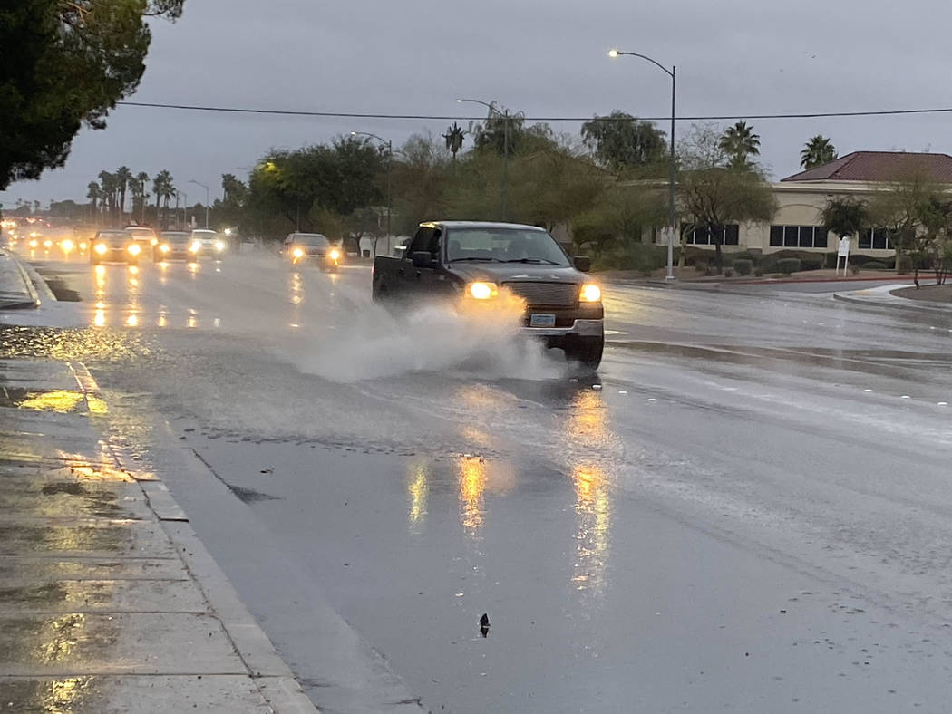 A truck sends a shower of water near Eastern Avenue and Viking Road on Wednesday, Nov. 20, 2019 ...