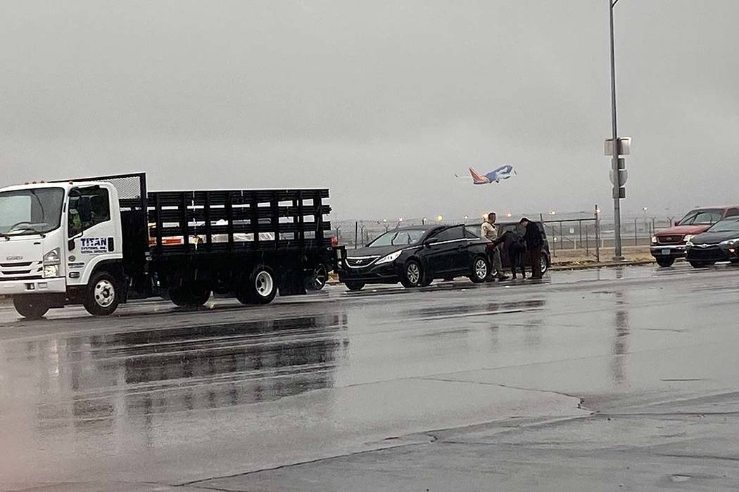 A Las Vegas police officer investigates a minor crash on Sunset Road near McCarran Internationa ...