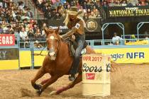 Tiany Schuster rounds a barrel aboard her horse JSYK I'm Famous on Dec. 7, 2017, during the fir ...