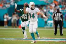 Miami Dolphins quarterback Ryan Fitzpatrick (14) throws a pass against the New York Jets during ...