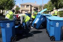 In this June 30, 2017, file photo, Republic Services of Southern Nevada employees deliver new r ...