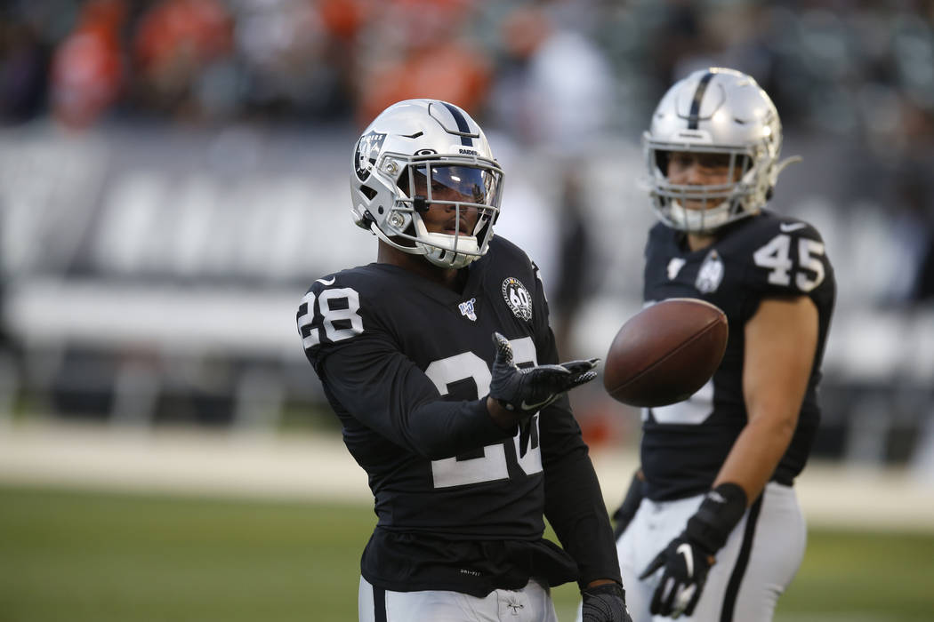 Oakland Raiders running backs Josh Jacobs and Alec Ingold (45) before the start of an NFL footb ...