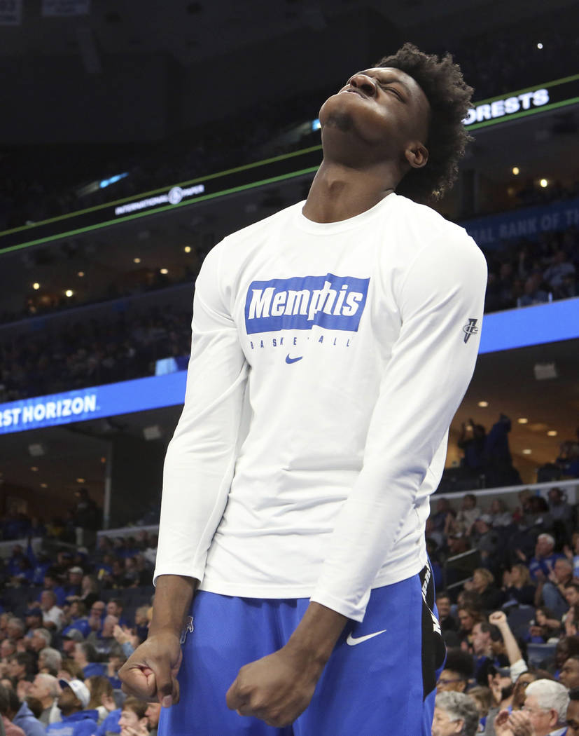 Memphis' James Wiseman reacts to a play from his spot on the bench as he sat out of an NCAA col ...