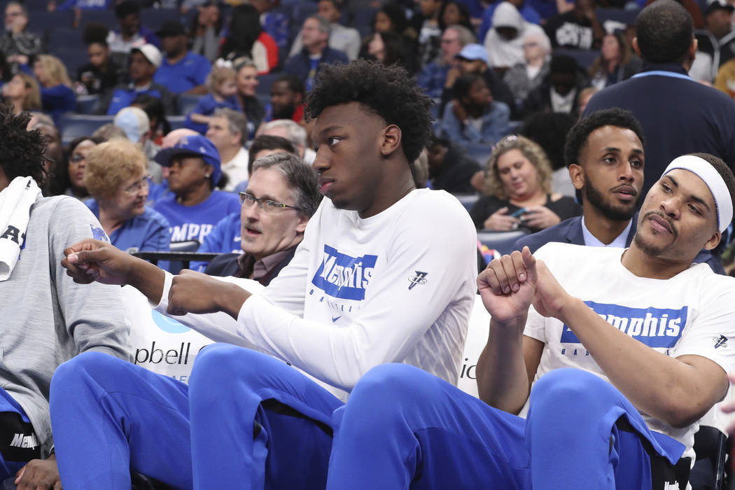 Memphis' James Wiseman, second from right, sits out the game along with Isaiah Stokes, right, i ...