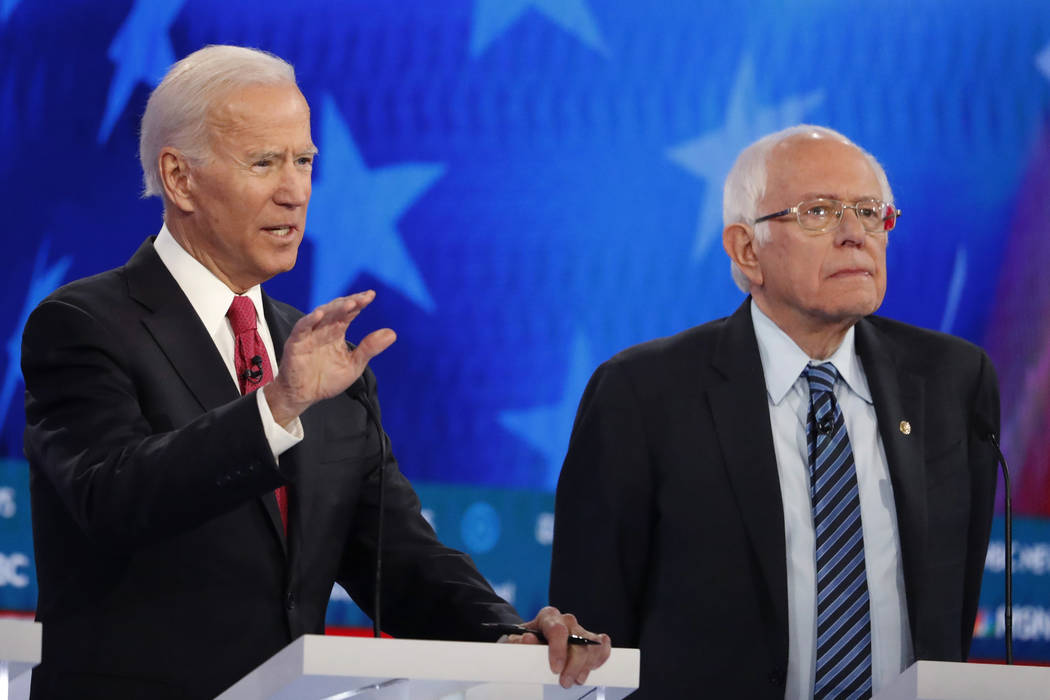 Democratic presidential candidate former Vice President Joe Biden, left, speaks as Democratic p ...