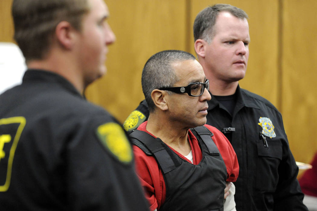 Vagos motorcycle gang member Ernesto Gonzalez is led from district court under heavy security i ...