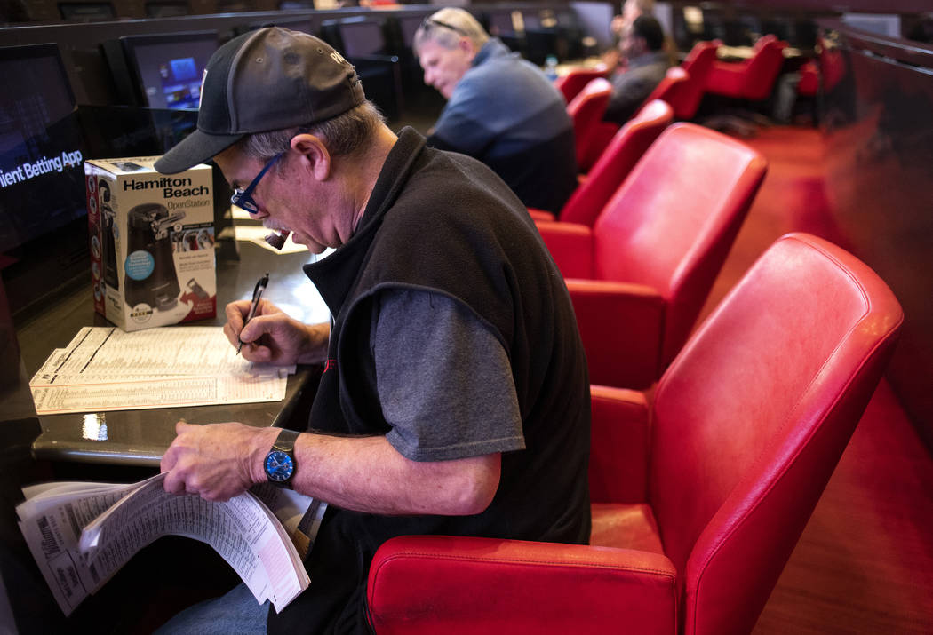 Tom Schiffhauer of Las Vegas places a bet at the Palms sportsbook on Thursday, Nov. 21, 2019, i ...