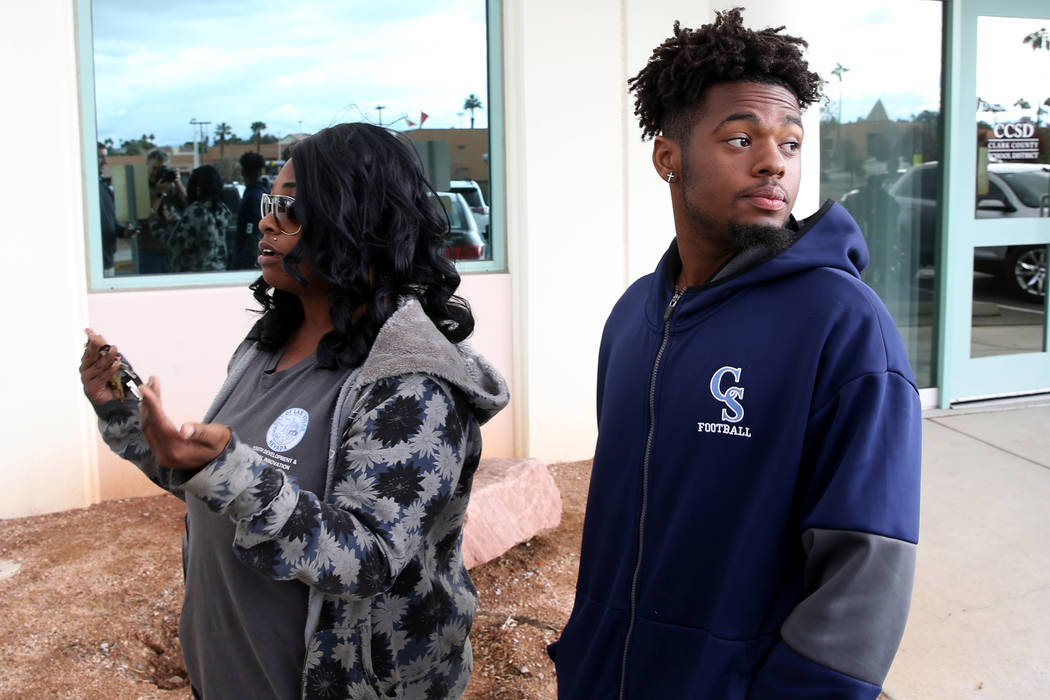 Canyon Springs quarterback DJ Lewis-Bealer and his mother Shalicia Lewis talk to a reporter out ...