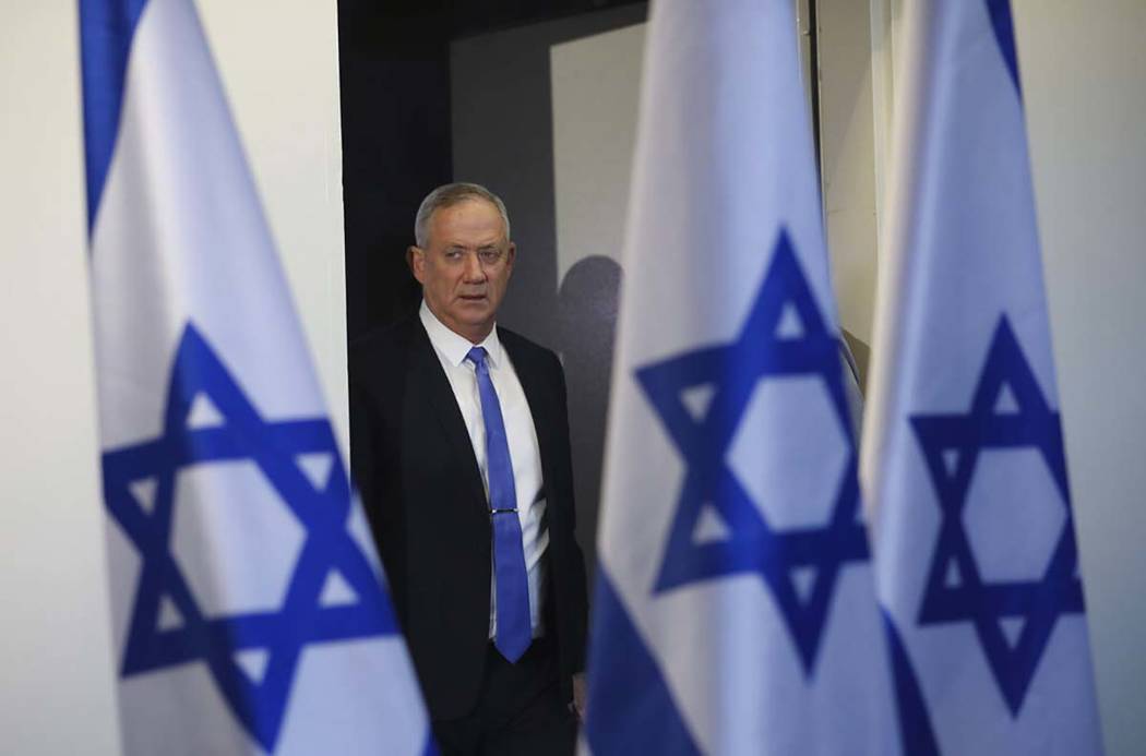 Blue and White party leader Benny Gantz arrives to address media in Tel Aviv,Israel. Wednesday, ...