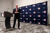 Baseball commissioner Rob Manfred steps away from the podium after speaking to the media at the ...