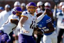 East Carolina quarterback Holton Ahlers attempts a pass during the second half of an NCAA colle ...