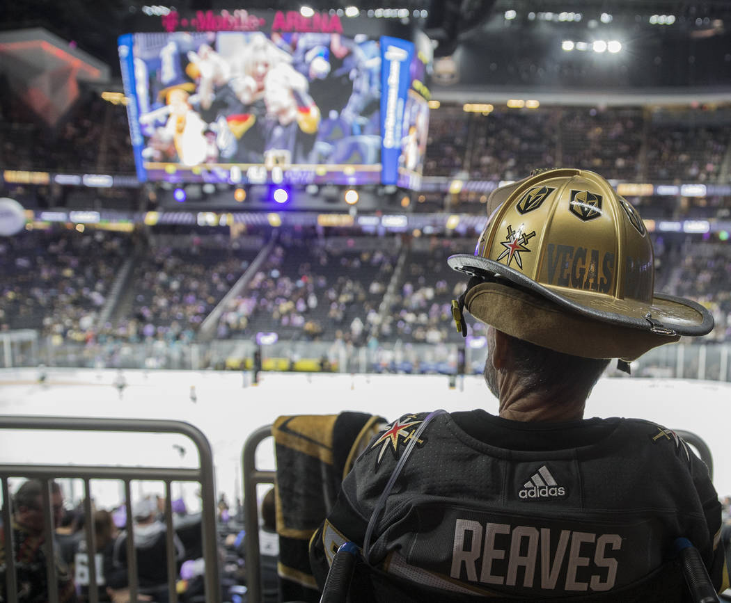 Golden Knights fans David Steele cheers for Vegas during their NHL hockey game with the San Jos ...
