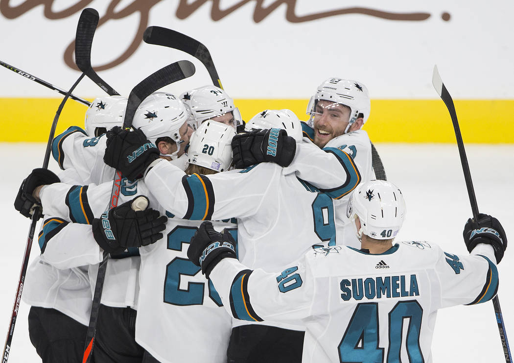 San Jose Shark players celebrate after beating the Vegas Golden Knights in the overtime during ...