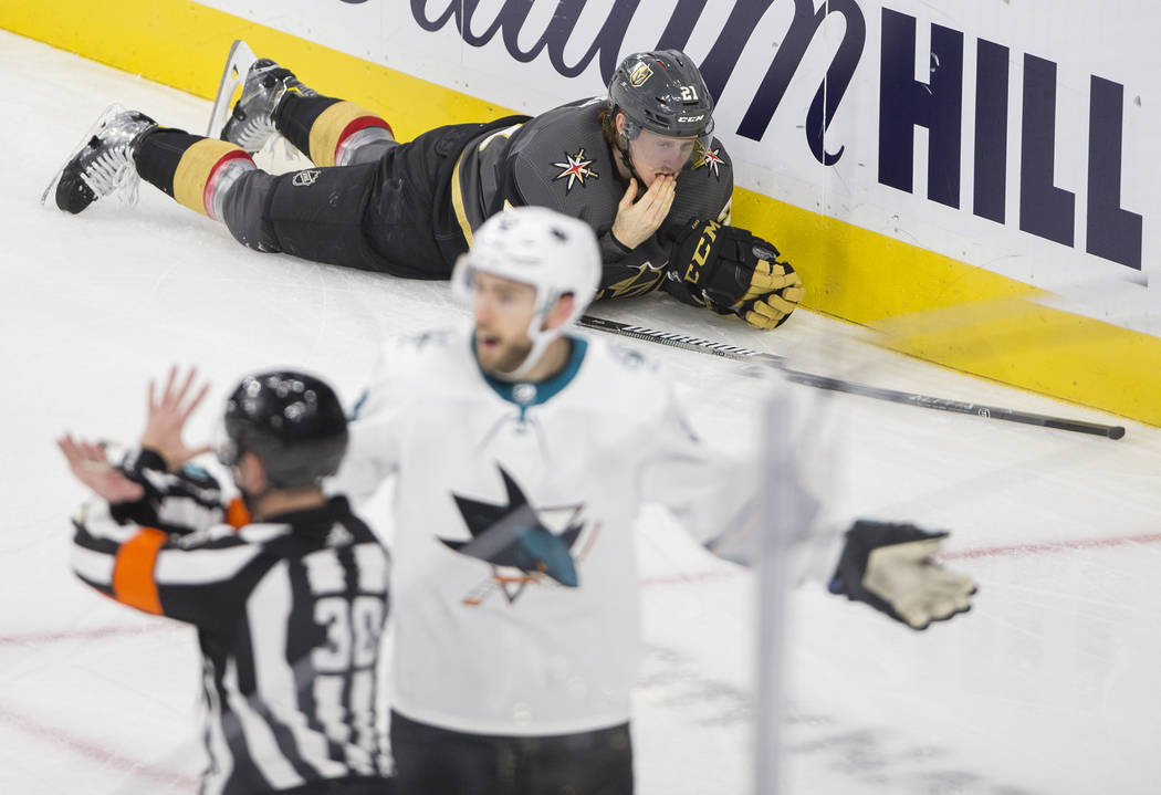 Vegas Golden Knights center Cody Eakin (21) lays on the ice after a hard hit in the third perio ...