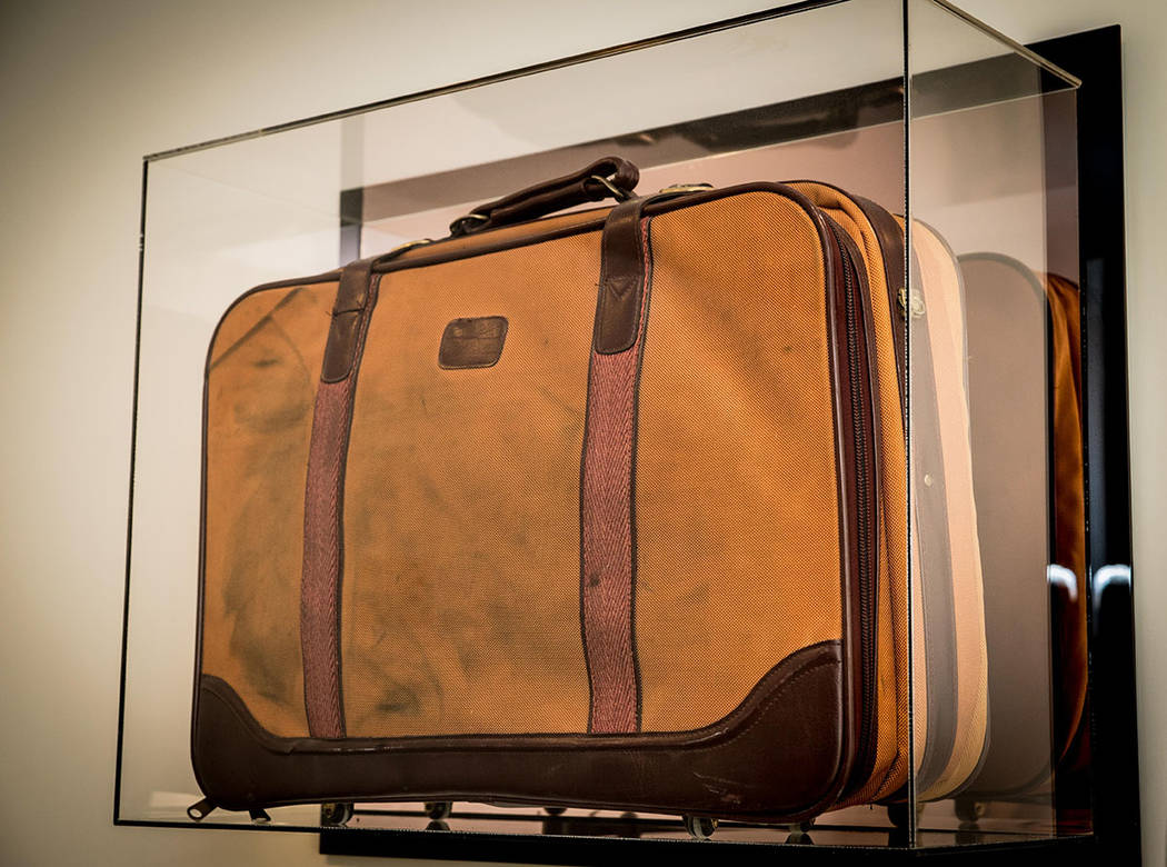 This framed brown suitcase is a reminder of when Saville Kellner came to the U.S. from South Af ...