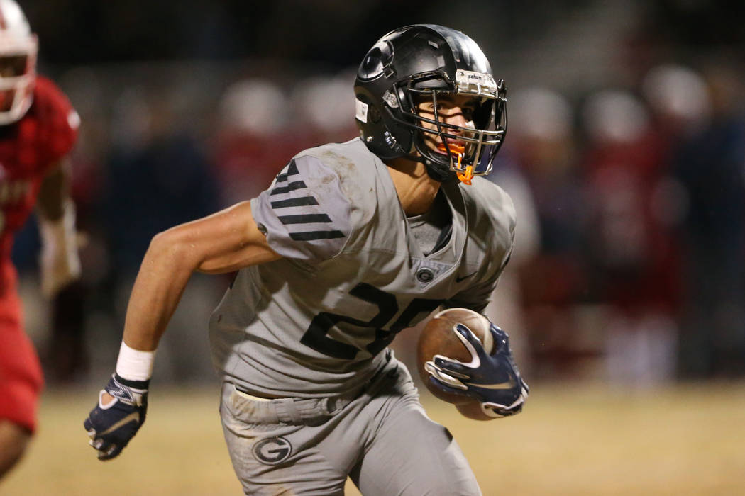 Bishop Gorman Cam Hunterton (28) runs the ball for a touchdown after a catch in the second quar ...