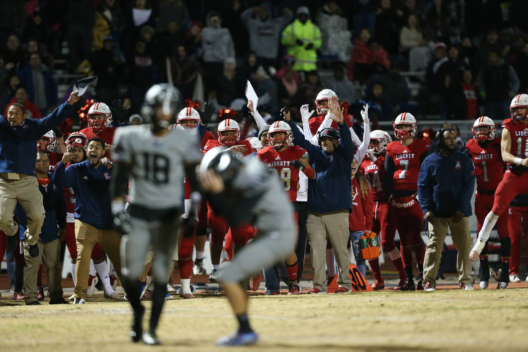 Liberty celebrates a missed field goal by Bishop Gorman Dylan Hamika (43) in overtime of the fo ...