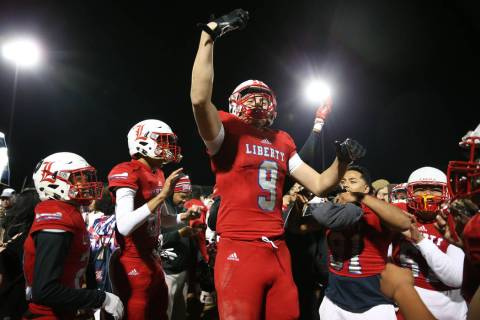 Liberty's Moliki Matavao (9) celebrates his team's 30-24 overtime win against Bishop Gorman in ...