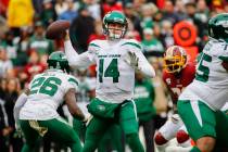 New York Jets quarterback Sam Darnold (14) looks to pass the ball in the first half of an NFL f ...