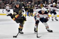 Vegas Golden Knights right wing Ryan Reaves (75) shoots next to Edmonton Oilers defenseman Cale ...
