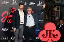 TV host Jimmy Kimmel, left, and Tony Rodio, right, CEO of Caesars Entertainment, wave to the cr ...