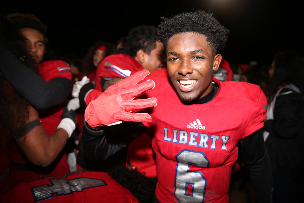 Liberty's Donte Bowers (6) celebrates his team's 30-24 overtime win against Bishop Gorman in th ...