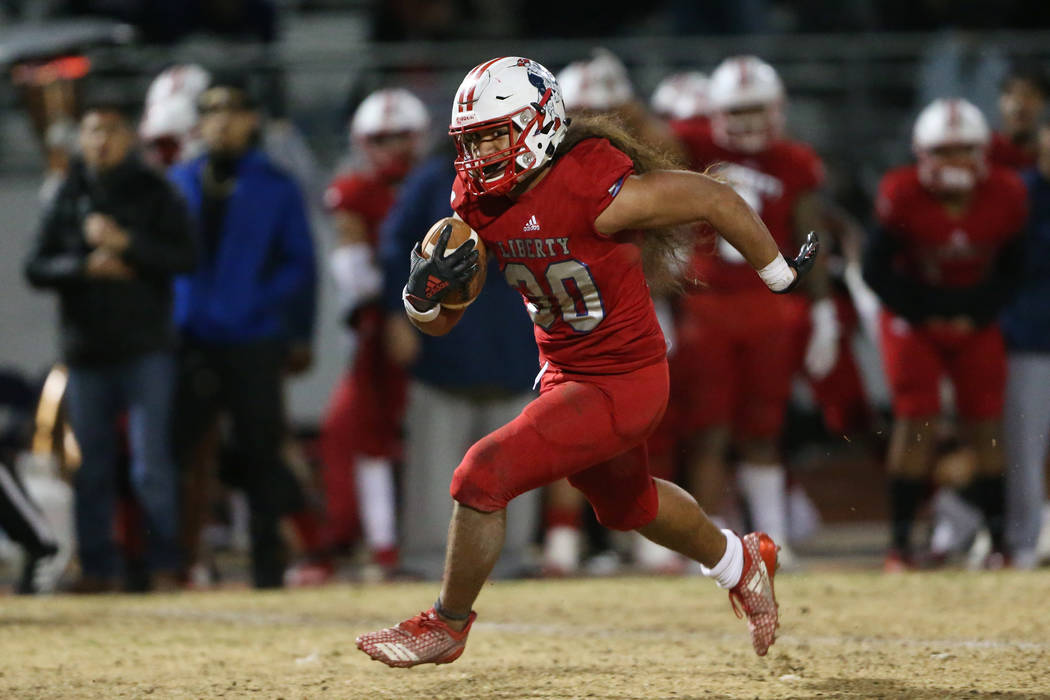 Liberty's Zyrus Fiaseu (30) runs the ball in the fourth quarter against Bishop Gorman during a ...