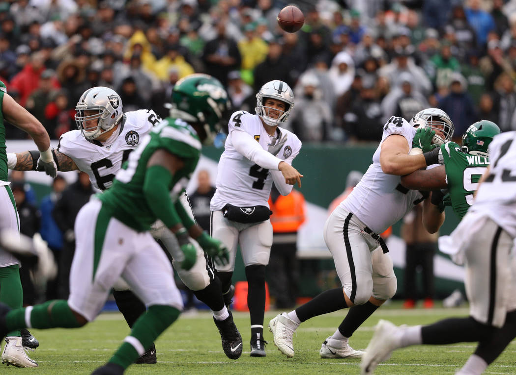 Oakland Raiders quarterback Derek Carr (4) throws the football during the first half of an NFL ...