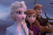 This image released by Disney shows Elsa, voiced by Idina Menzel, from left, Anna, voiced by Kr ...