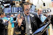 Trader Gregory Rowe works on the floor of the New York Stock Exchange, Friday, Jan. 18, 2019. ( ...