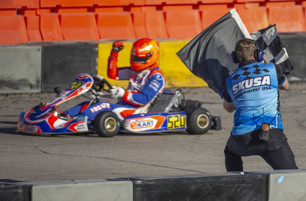 X30 Master driver Kip Foster takes the checkered flag during the SKUSA SuperNationals at the Ri ...