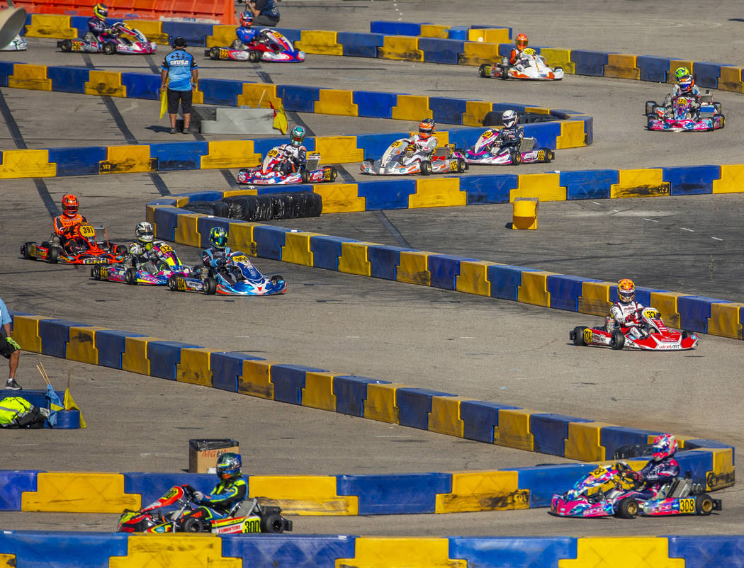 The X30 Masters fight for position on the track during the SKUSA SuperNationals at the Rio on S ...