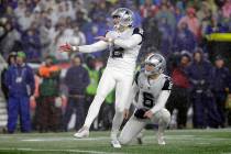 Dallas Cowboys kicker Brett Maher follows through on a field goal attempt in the first half of ...