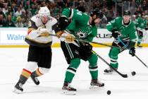 Vegas Golden Knights right wing Reilly Smith (19) challenges Dallas Stars left wing Jamie Benn ...