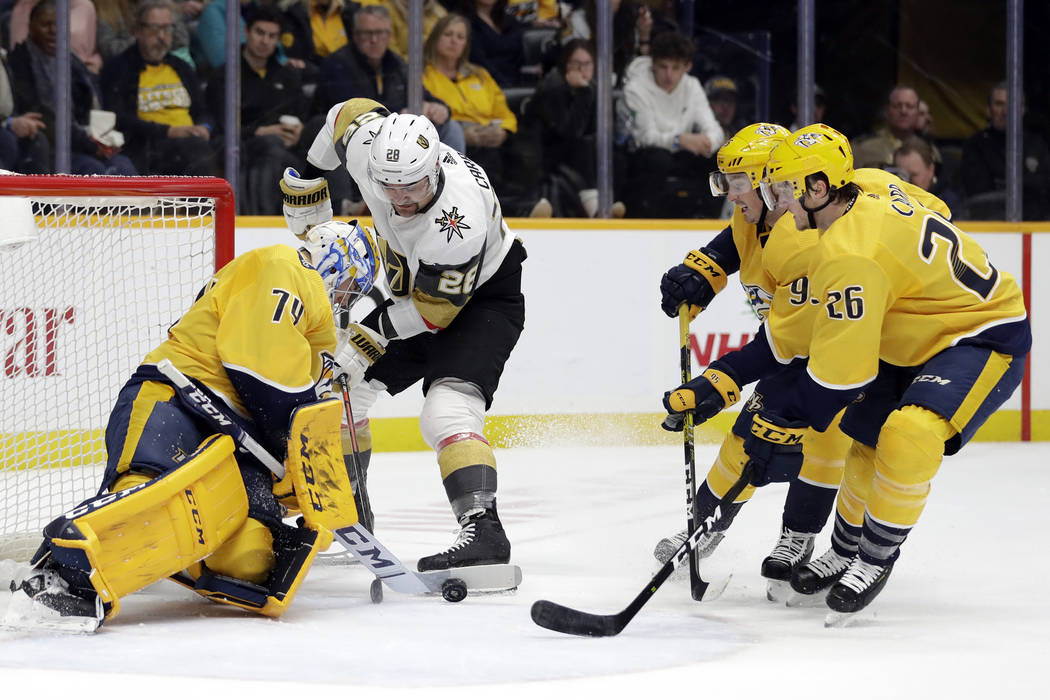 Nashville Predators goaltender Juuse Saros (74), of Finland, blocks a shot by Vegas Golden Knig ...