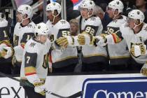 Vegas Golden Knights left wing Valentin Zykov (7) is congratulated by teammates after scoring a ...